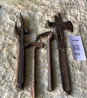 Group shot of all four antique nail puller tools