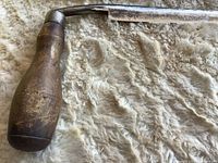 Left handle and portion of blade showing wear