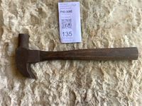 Full view of Maydole claw hammer on fabric background