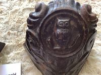 Front view showing owl medallion and scroll design