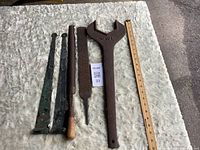 All six tools laid out for size reference next to ruler