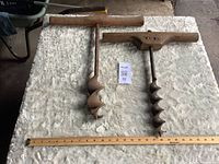 Both augers full view with ruler for scale
