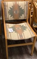 Front view of side chair showing upholstery pattern and wood frame