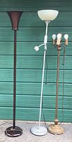Front view of all three floor lamps standing side by side