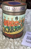Front view showing marching soldiers graphic and MARCELLA branding