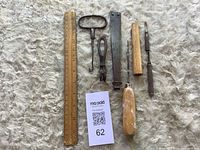 All four tools with ruler for scale