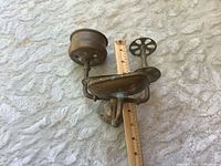 Overall view showing soap dish, cup holder, ruler indicating width, patina