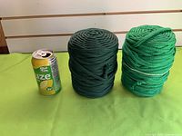 Both macramé cord spools with soda can for scale