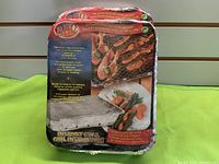 Front view of two sealed disposable grills