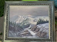 Full view of framed mountain landscape painting