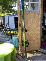 Full view of Volkl Carver XT skis leaning against shed