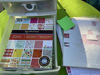 Top drawer open showing Recollections cardstock pad and loose patterned sheets