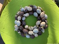 Full view of wreath on green surface