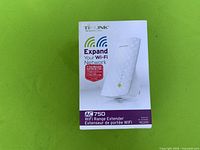 Front of boxed TP-Link AC750 Wi-Fi range extender model RE200