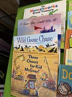 Group of children’s books showing The Munschworks Grand Treasury, I Know You Could Do It!, Wild Goose Chase and Three Cheers for Kid McGear!