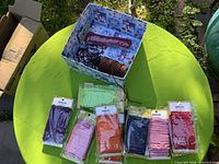 Lot overview showing boxed cords and six sealed bundles