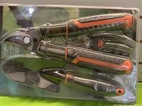Full view of sealed Black & Decker blister pack showing all three garden tools