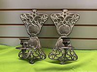 Front view showing both metal wall candle sconces