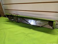 Light fixture interior showing bulbs and reflective surface