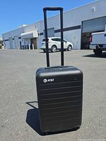 Front view of suitcase with telescoping handle extended