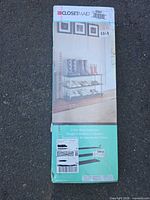 Sealed retail box showing ClosetMaid branding and rack image
