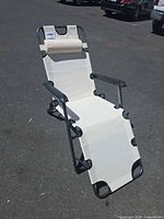 Chair standing upright showing overall design, color and pillow