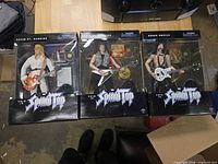 Front view of all three boxed figures side-by-side