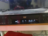 Front of Sony DVP-NS300 powered on showing display