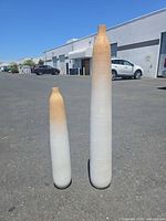 Both vases standing side by side showing size difference and colour gradient