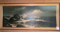 Full view of framed seascape print on wall