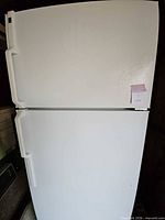 Front exterior of white two-door Hotpoint refrigerator