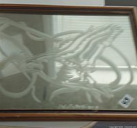 Framed mirror with etched duck design