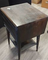 Full view of side table showing overall design and condition