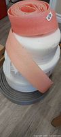 stack of grey, white and pink foam rolls
