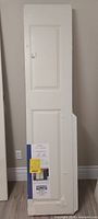 Front view of packaged 2-panel folding door showing size and condition