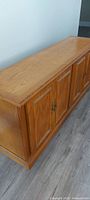 Oak base cabinet three paneled doors view
