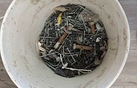 top view inside pail showing assorted fasteners