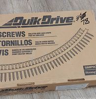 Closed Quik Drive cardboard box with branding visible