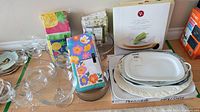 All items grouped: platters, glassware, charger plate box, napkins