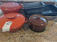 Overall lot showing Dutch ovens, loaf pans, roasting pans