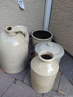 Group shot of four stoneware pieces showing overall forms and finish