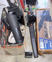 Leaf blower main unit, nozzle tube and collection bag inside open box