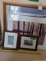 Group shot of all three framed prints with tape measure for scale
