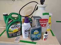 Group shot of all items on shelf showing sprayer and chemical containers