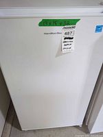 Front view of white Hamilton Beach compact fridge showing exterior condition