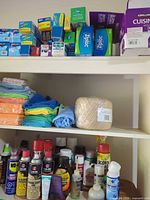 Three-shelf cabinet with bags, cloths, twine, lubricants