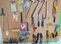 Overall view of pegboard with majority of tools displayed