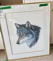 Full view of framed print showing wolf portrait, frame, mat