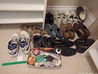 All shoes and care kit on floor for overview