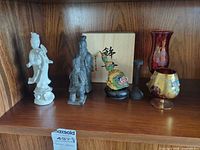 Full view of all decorative items on shelf